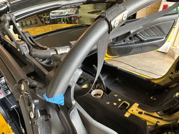 He used some painters tape to plug the frame while drilling out the rivets to prevent the metal from falling out into the interior. 