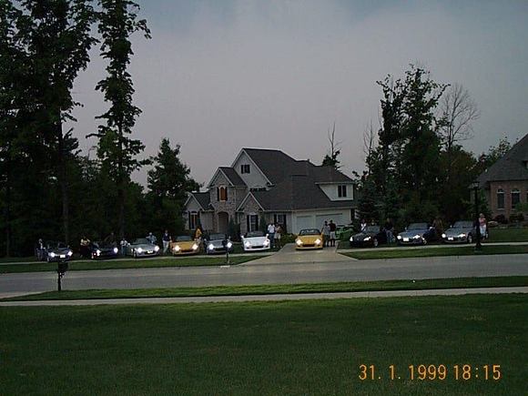 Cars in front of house Friday lights on