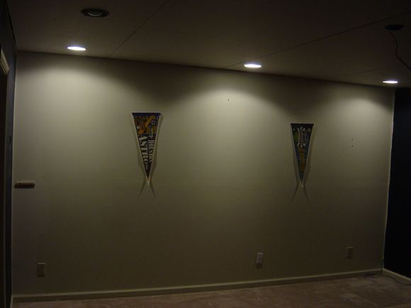 Recessed lighting on back wall