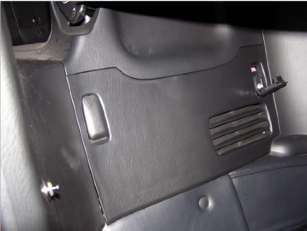 Behind passenger seat