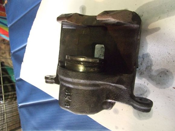 Drivers calpier piston with dust boot removed