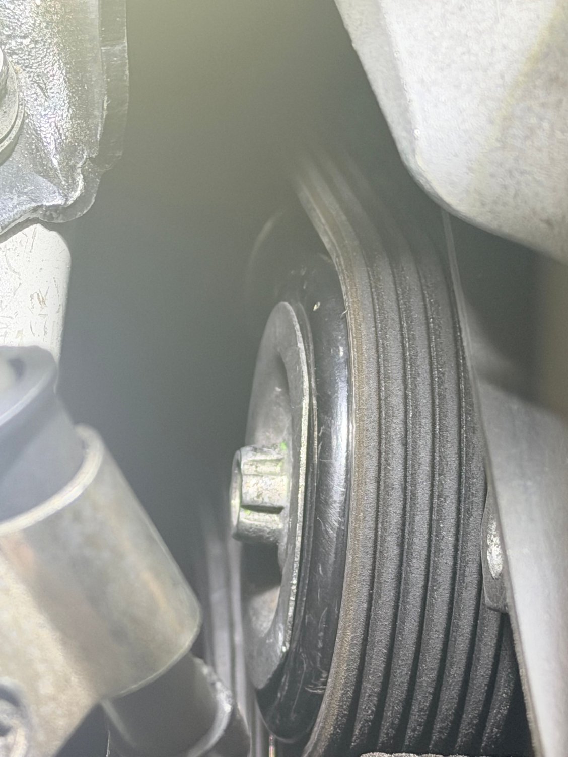 What tool can i use to take this bolt out of the idler pulley? Its not the spline socket. 