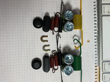 This kit replacement have a yellow color and a green color large spring. Please let me know which one is for the right side? The Driver rear side? Thank you.
