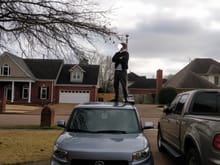 My friend standing on top of my car :)