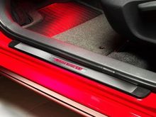 illuminated red and stainless-steel door sills