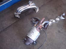 Size difference between the OEM exhaust manifold and the OBX R full racing header. (4-1)