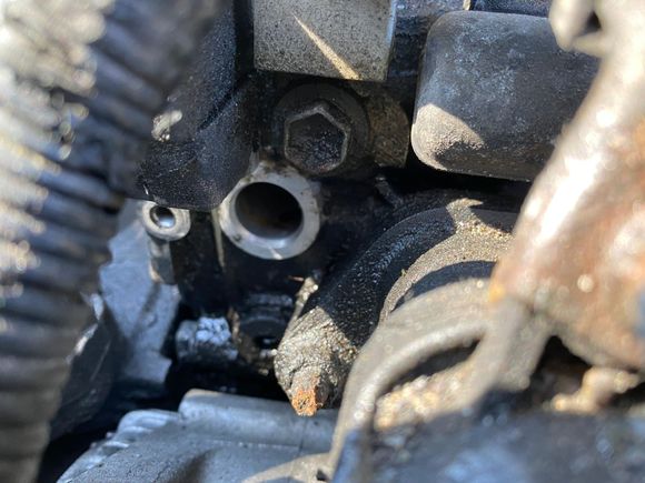 Here is the hole after removing the VVT. I try to remove the interior round mesh to clean. I can not find it. Must be deep more than 3/4 inches? Or is gone?