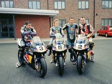 Me and the Renegade Ducati BSB squad. My hero Michael Rutter (stood), me sat on Michael's bike :-), Nick Medd in the middle and a young Leon Haslam on the end