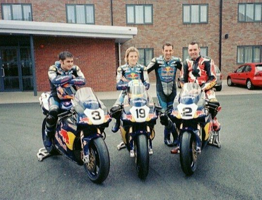 Me and the Renegade Ducati BSB squad. My hero Michael Rutter (stood), me sat on Michael's bike :-), Nick Medd in the middle and a young Leon Haslam on the end