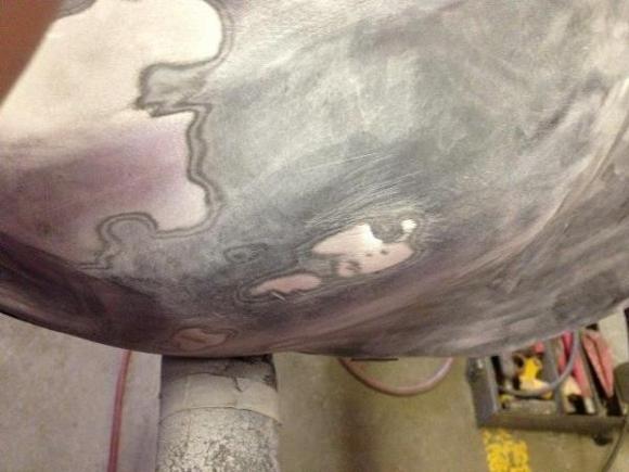 Dent in tank, ground off the honda wings and DA'd the surface.