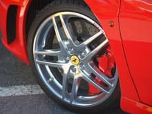 F430 Spider wheel; ball-polished, red calipers, carbon ceramic brakes.