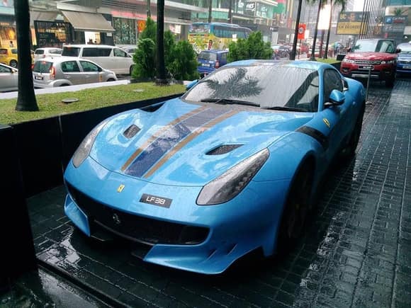 This stunning Ferrari F12 TDF was the first unit to hit the streets of Kuala Lumpur, Malaysia. Also, the color of this beauty is called "Blu Flugplatz". Interesting...