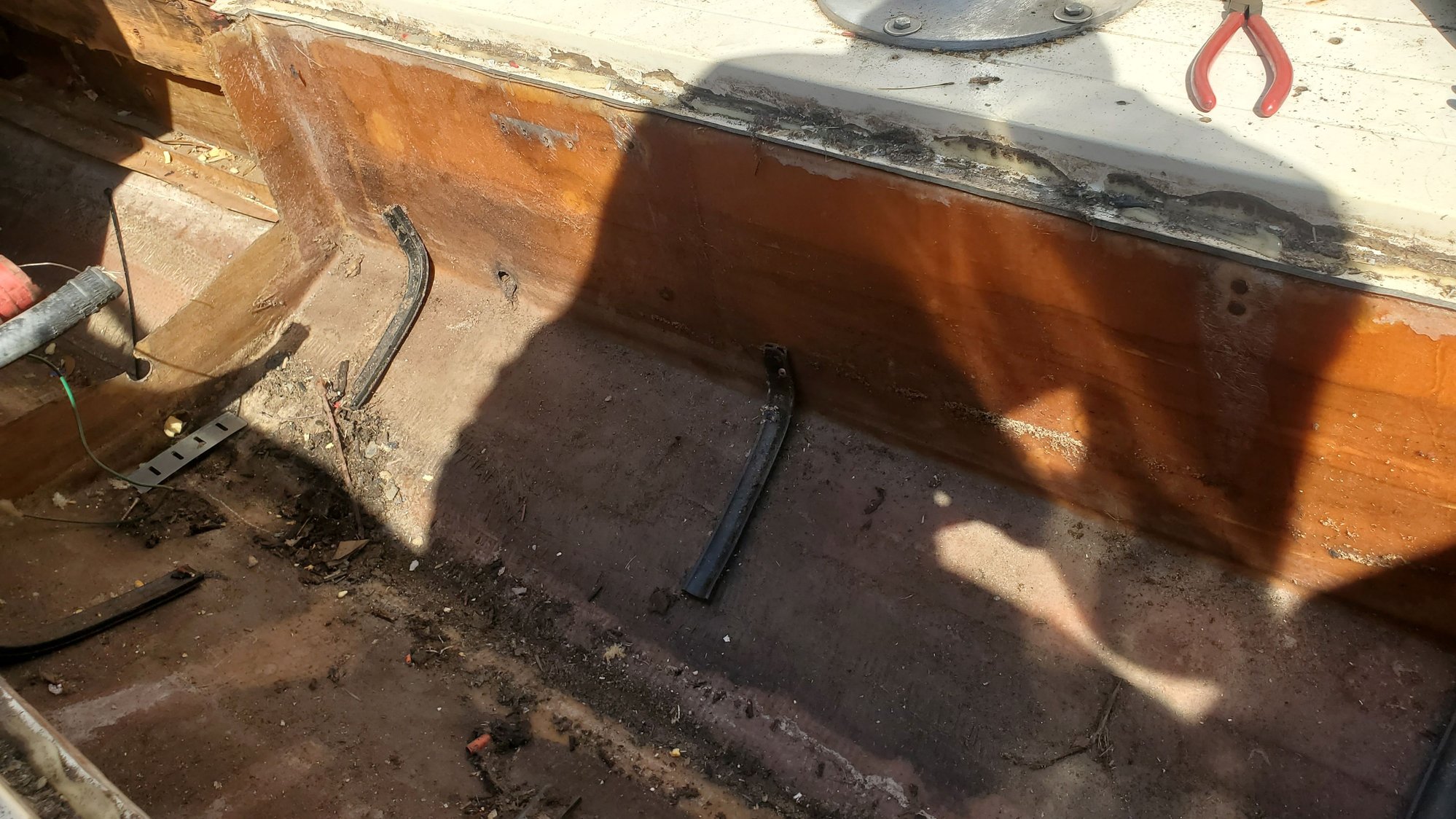 Where gas tank used to be. Worried about dark wood near bottom of stringer. 