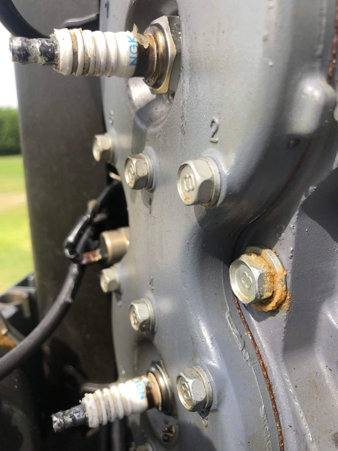 Black ring around outside NGK spark plug Yamaha 150 2 stroke outboard