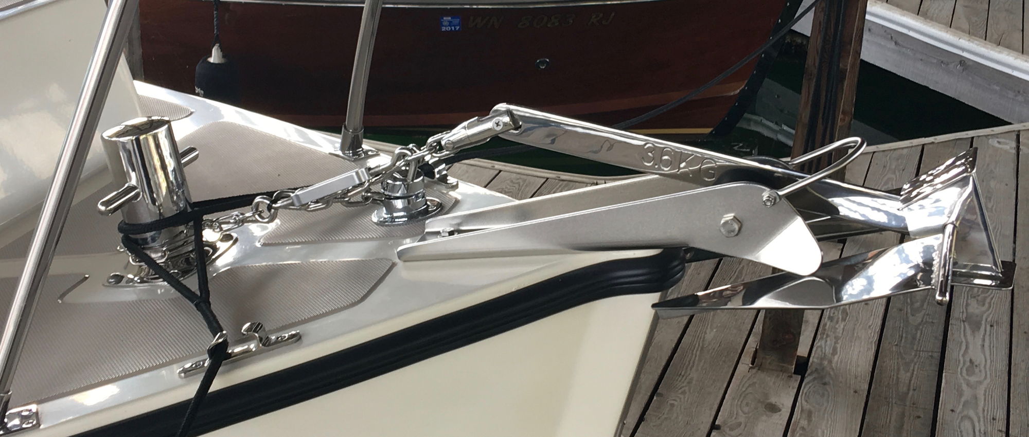 How do you secure your anchor on the bow roller? Page 3 The Hull