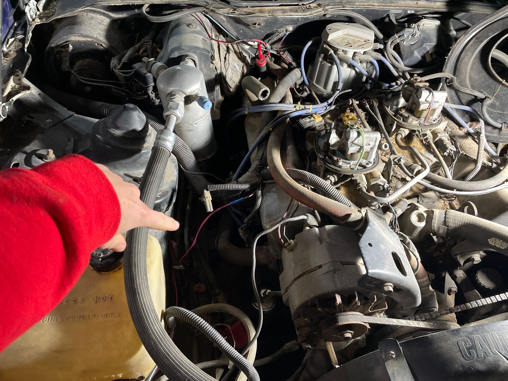 They are located at the passenger front of the engine bay. 