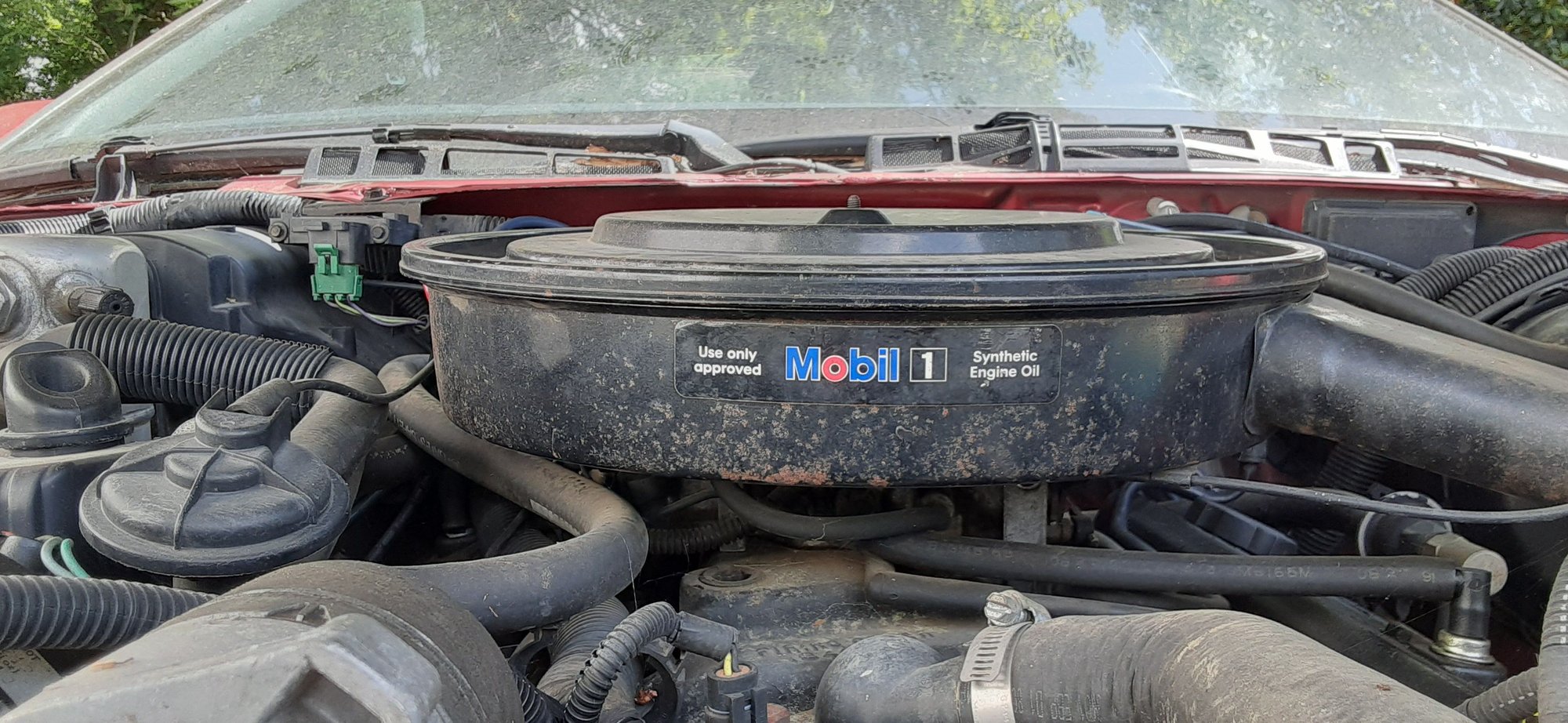 My air cleaner wingnut is not installed so my air cleaners assembly is slightly drooping toward the driver side just the slightest bit.