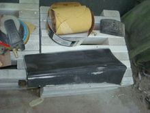 Passenger rear lower ground effect off the parts car sanded and ready for epoxy.