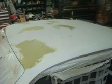 Driver side after more hammer and dolly work on the front corner and a little more bondo.