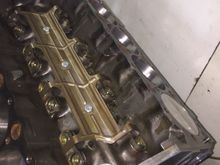 Scrounged u-pull and got lifter guides, pushrods, and cam bolts