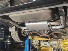 1989 Trans Am GTA ACS Convertible with a replacement "Hog Clamp" style N10 intermediate pipe, AP/Eastern muffler and tailpipes. Squint closely toward the front of the car and you will see the OEM GM "AC" cats have been replaced with Magnaflow cats welded in their place.
