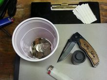 The goodies I found while cleaning out the car. Was around $6 in change, a nice "big john" knife, a lighter, and a 35mm film canister with weed residue in it lol!
