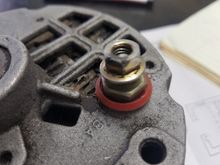 Battery post that needs to be unscrewed to allow the rectifier to be removed.