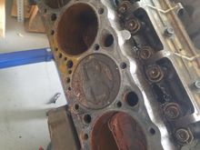 Passenger side.  Oil present in some of the cylinders, either squirted in there to loosen up the rings or major issues going on in the heads