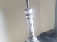 Using a nail punch to press the shaft complete out of the housing.