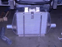 This is the correctly sized charge air cooler I fabricated for this car. Seems like procharger original is much undersized! Took up so much room had to incorporate the hood latch mount into the cooler.