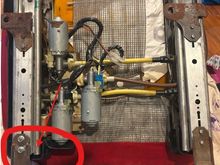 Front of the seat is toward the bottom of the picture.  Circled area is area near where it cracked. (door side of driver's seat)