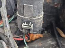 Where the brown wire that was cut and tied into to main relay leads. 