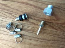 The fittings, M16-1.5 male to 1/4NPT female,  1/4 NPT to 1/4 hose barb.  3 hose clamps.  and a tire Schrader valve to make it easier.