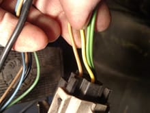 From left to right brown wire, yellow wire, green and green.