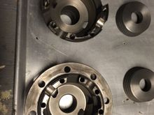 Original posi carrier machined to accept the new style posi cones. The new cones don't have the recessed area, so the carrier needs the inner ridge machined off.