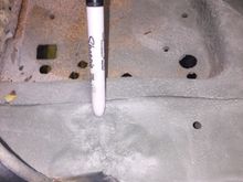 Old damage from accident on passenger side by battery box