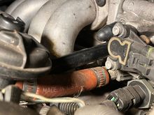 Passenger side hose connected to throttle body