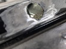THIS IS WHAT STARTED THIS WHOLE MESS!  A hole in the T-Roof on the pass side that was gooped so full of body filler, there was a 2" plug stuffed into the hole...