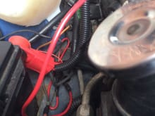 The original alternator wire from the factory harness can be seen.  It runs from the factory black cylinder connector on the bottom and screws into the 2006 Trailblazer harness.
