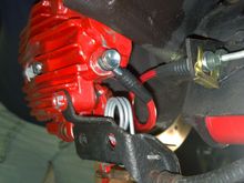 The wire that passes through the hole used to have a hook on it.