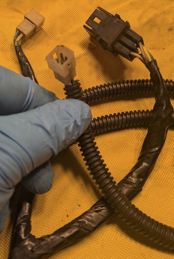 Dash Harness.  Black plug to switch, one white plug to each window.  Short end is driver side.  Runs across the top of the dash, tucked under the vents.  