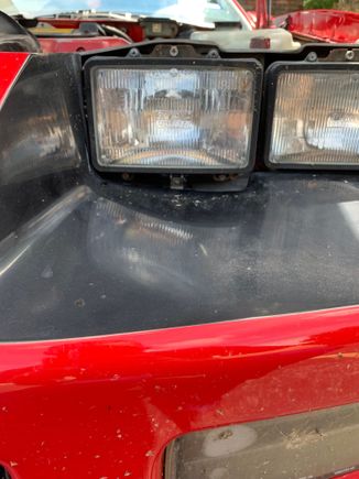 Driver side, gap underneath headlight