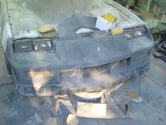 Taking the bumper cover down to the factory base paint.