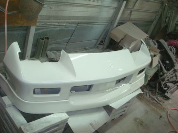 Third coat, the spoiler looks decent but the cracks are on the bottom side where it rolls under and will be mostly repaired from the back side.
