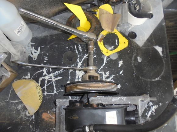 Pulling the pulley off the pump.