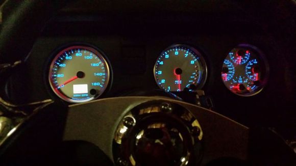 night time shot of gauges with leds
