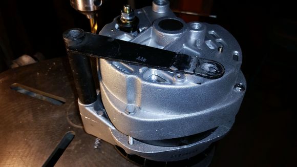 I was going to turn a nice little aluminum spacer for the pivot bolt side, but I noticed that if the stock spacer/bracket was straightened it would come very close to working, so I threw it in my 40ton press and straightened it out... yea this can be made to work.