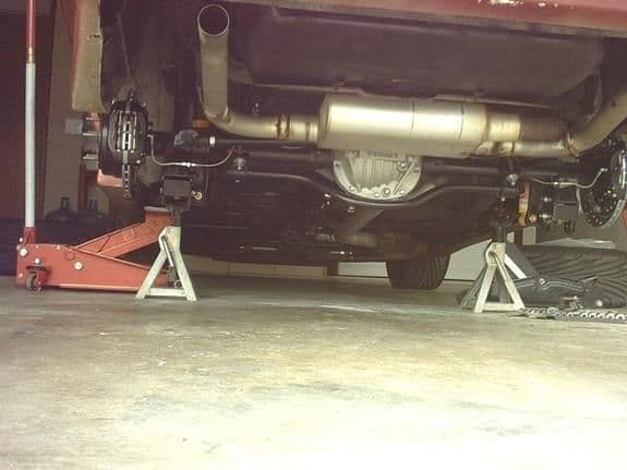 Older pic of exhaust prior to that being lightened. Lightweight Wilwood rear disc. Not the clocking on the sway bar axle mounts. The wheel base is shortened 1 1/2"
