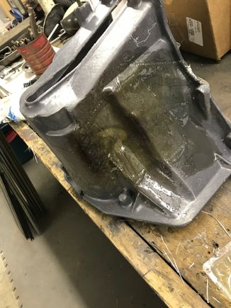 Cleaned the area several inches back from the damaged area, braced the broken pieces with vice grips and got to fiberglassing this thing back together.