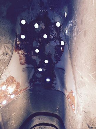 These are the wholes I had to drill out to release the e brake plate in the trans tunnel. Don't forget you have to do this twice(To the one from the donor car as well)